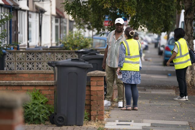 A council worker issues advice to residents 