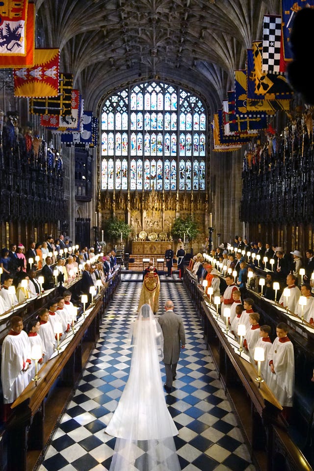 Meghan Markle was met by the Prince of Wales half way up the aisle amid the splendour of St George’s Chapel. (Dominic Lipinski/PA)