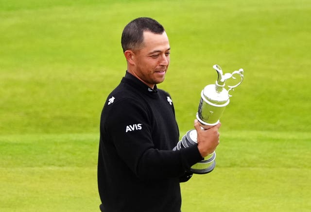 Xander Schauffele looks at the Claret Jug