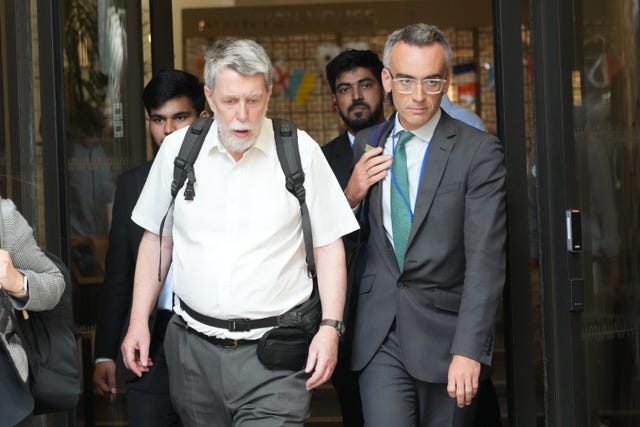 Gareth Jenkins (left), former engineer at Fujitsu Services Ltd leaves after giving evidence to the Post Office Horizon IT inquiry at Aldwych House, central London.