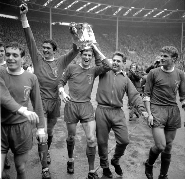 Liverpool’s Ian Callaghan, Ron Yeats, Wilf Stevenson, Gordon Milne and Roger Hunt parade the FA Cup around Wembley in 1965