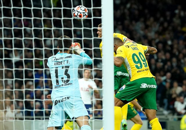 Pacos Ferreira defender Antunes, top, glances the ball past his own goalkeeper to put Tottenham 3-0 up