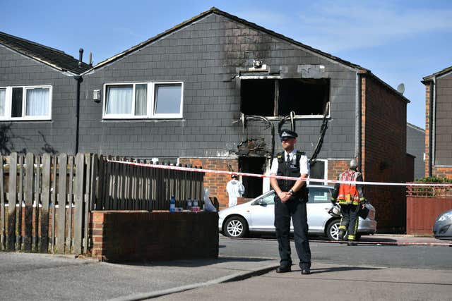 A police officer at the scene of a house fire on Adolphus Street, Deptford, south-east London, in which a seven-year-old boy has died. The Metropolitan Police have said they are treating the fire as suspicious (Dominic Lipinski/PA)