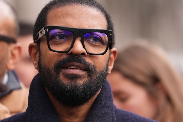 Headshot of Noel Clarke wearing glasses