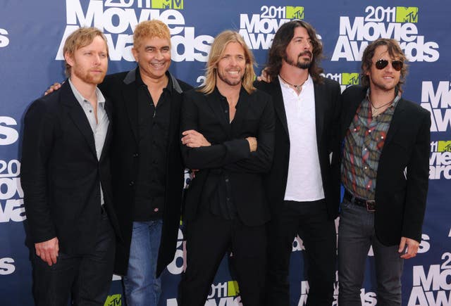 Foo Fighters in 2011, from left to right, Nate Mendel, Pat Smear, Taylor Hawkins, Dave Grohl and Chris Shiflett at the MTV Movie Awards 2011 at the Gibson Amphitheatre in Universal City, Los Angeles