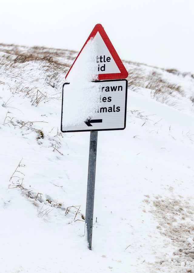 A snow covered road sign in the Yorkshire Dales National Park (Danny Lawson/PA)