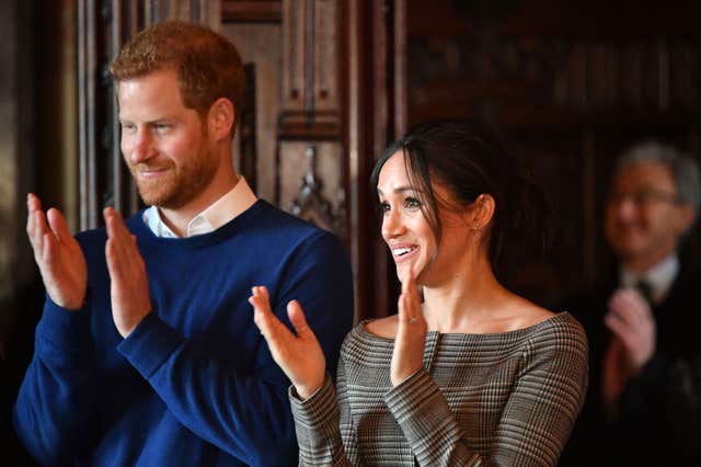Prince Harry and Meghan Markle watch a performance during a visit to Cardiff Castle (Ben Birchall/PA)