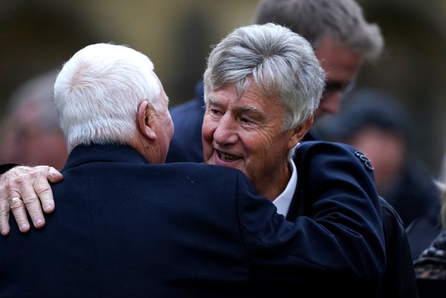 Former players Brian Kidd (right) and Mike Summerbee after the funeral service (Martin Rickett/PA)