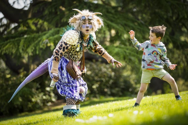 Hamish Lamont, aged five, meets 'The Undiscovered Creature' during a performance at the Royal Botanic Garden Edinburgh for the 2021 Edinburgh International Children’s Festival 
