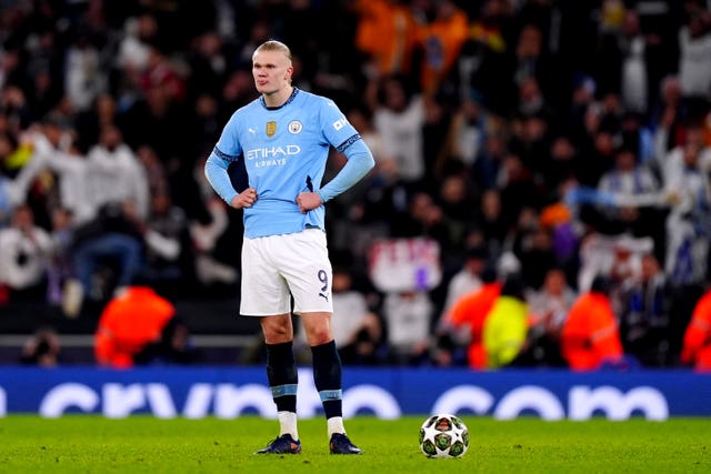 Erling Haaland puts his hands on his hips in frustration after Manchester City lose to Real Madrid