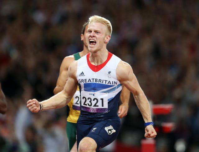 Great Britain’s Jonnie Peacock celebrates winning gold at London 2012