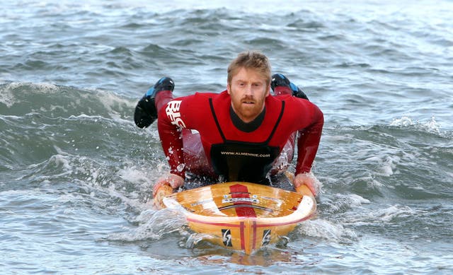 Surfer Al Mennie with his paddle board