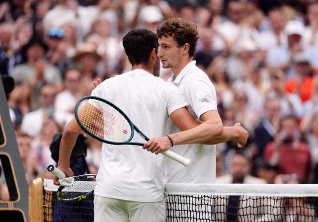 Carlos Alcaraz and Ugo Humbert (right) hug after their match