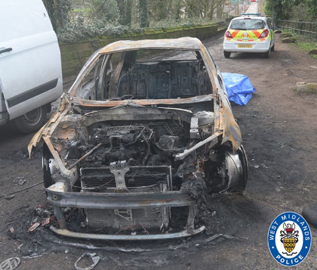 The burnt out remains of the stolen car used in the drive-by murder