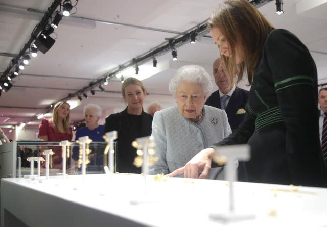 The Queen is given a tour of the London Fashion Week showrooms by Caroline Rush (Yui Mok/PA)