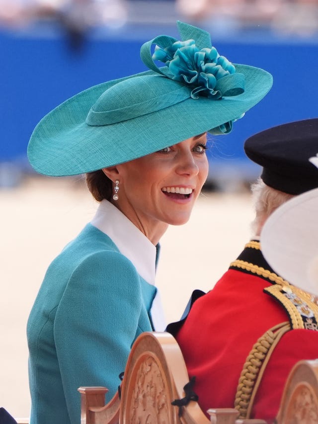 Kate wore blue to match the plumes of the Irish Guards