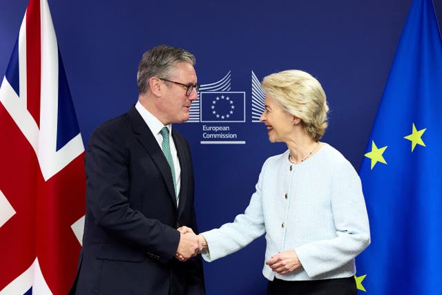 Prime Minister Keir Starmer shakes hands with European Commission president Ursula von der Leyen at the European Commission headquarters during a visit to Brussels