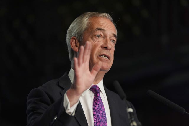 Nigel Farage speaking, with one hand raised