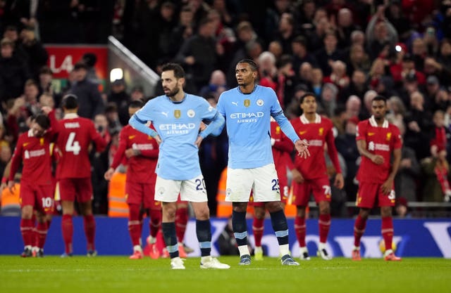 Bernardo Silva and Manuel Akanji appear dejected after Liverpool score