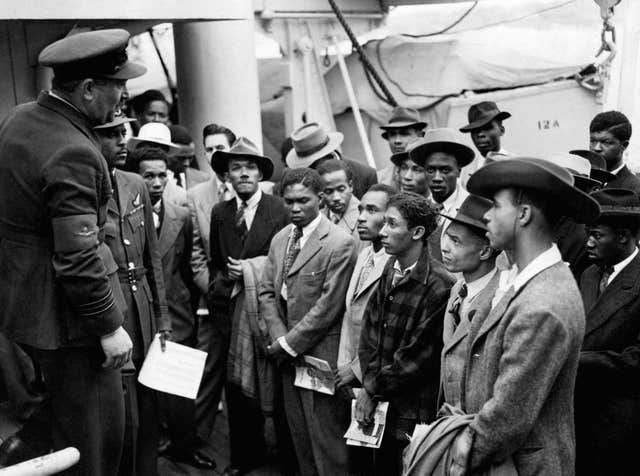 Jamaican immigrants being welcomed by RAF officials in 1948 (PA)