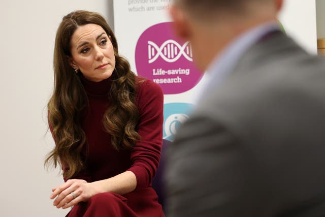 Kate looks serious as she talks with members of the hospital's staff