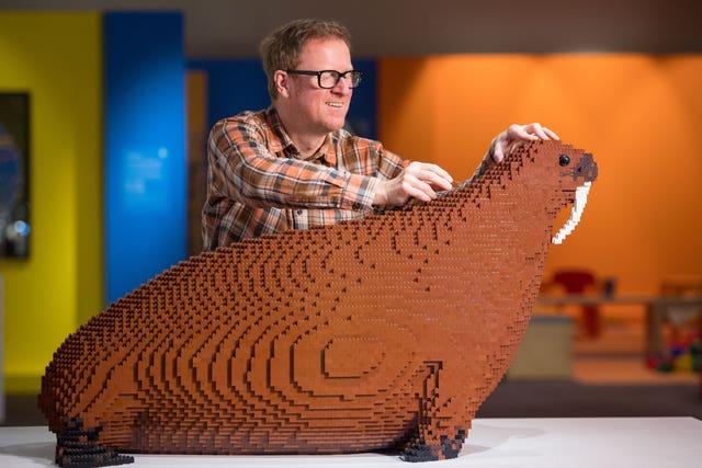 Technician Alistair MacKillop with a Lego brick model of the Horniman Museum’s famous ‘Overstuffed Walrus