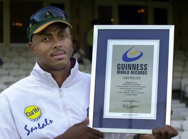 Courtney Walsh with a Guinness World Record certificate for most Test wickets