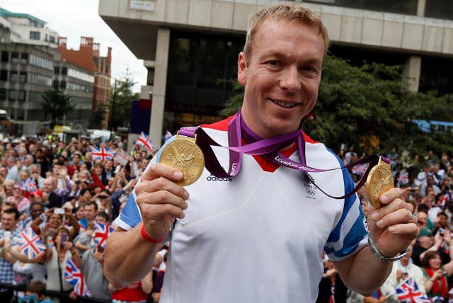 Cyclist Sir Chris Hoy wearing some of his Olympic medals