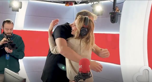 Amanda Holden and Jamie Theakston hug on Heart Breakfast 