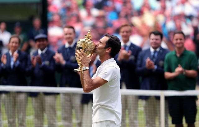 Federer with the Wimbledon trophy is 2017. He has won 20 grand slam singles titles (Gareth Fuller/PA).
