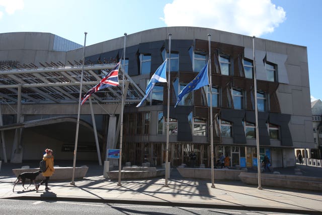 Flags fly at half mast outside the Scottish Parliament in Edinburgh