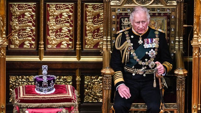 The Prince of Wales sits by the Imperial State Crown during the State Opening of Parliament in the House of Lords, London (