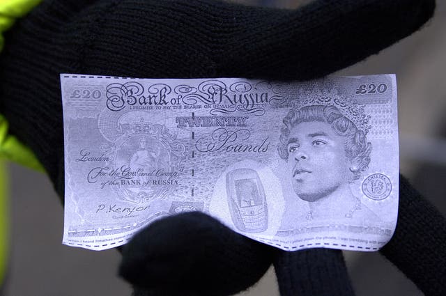 Arsenal supporters threw fake banknotes after claiming Cole moved to Chelsea to earn more money.