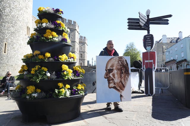 Artist Kaya Mar with a portrait of the Duke of Edinburgh