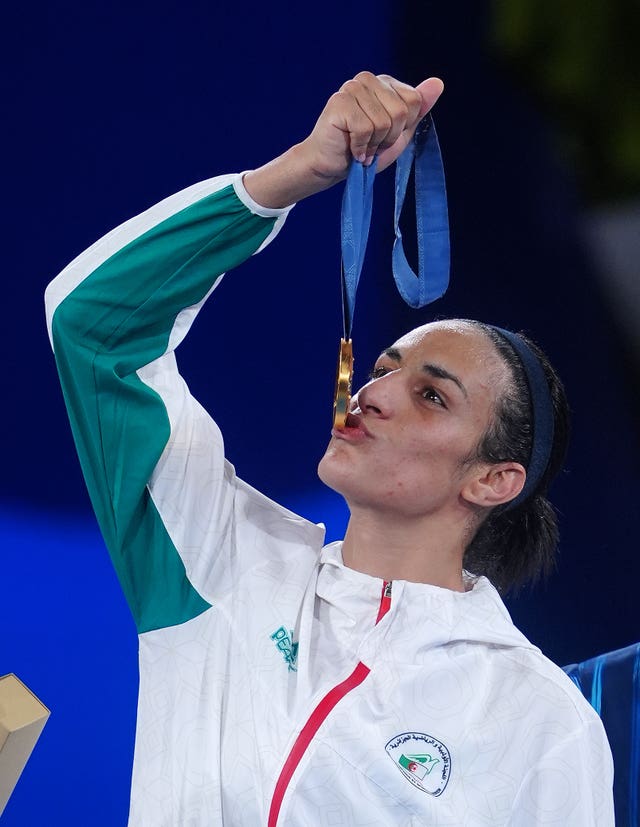 Imane Khelif kisses her gold medal after victory in the Olympic boxing tournament in Paris