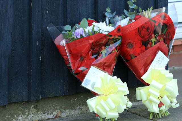 Floral tributes near the property in Bosworth Road, Adwick, Doncaster