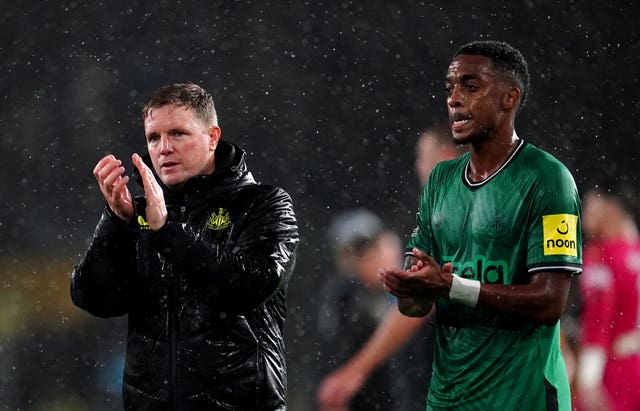 Eddie Howe, left, and Joe Willock applaud the Newcastle fans after the game