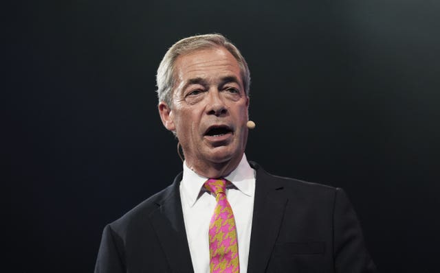 A close-up of Nigel Farage, dressed in a suit and tie