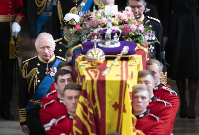 The King and members of the royal family following the Queen's coffin at her funeral, 11 days after her death 