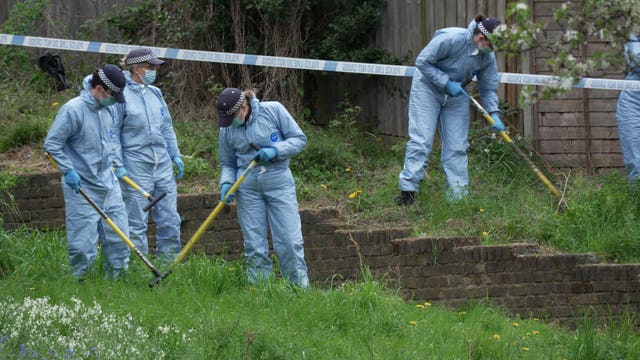 Forensic officers work the scene of the Woolwich shooting