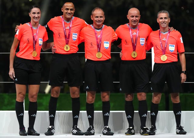Match officals Kathryn Nesbitt, Ismail Elfath, Pawel Sokolnicki, Szymon Marciniak and Tomasz Listkiewicz, left to right, after the World Cup final in Qatar