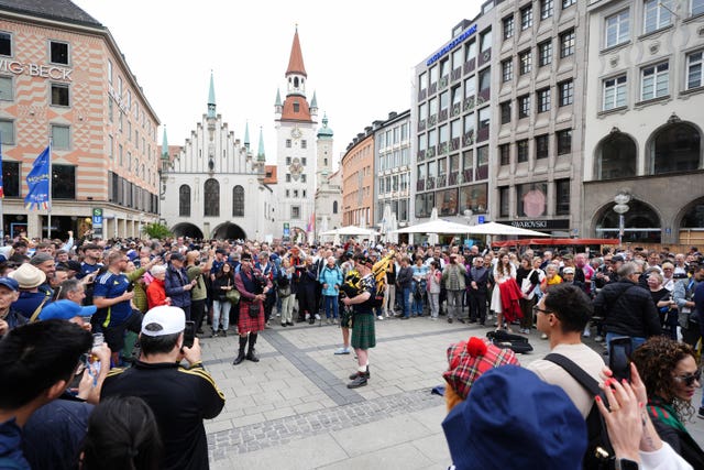 Scotland fans and pipers at Marienplatz square