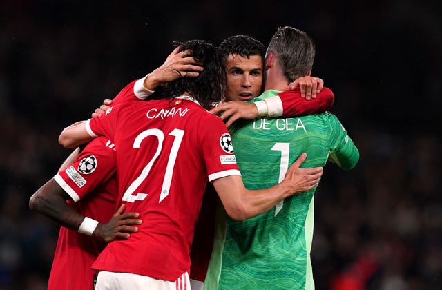 Cristiano Ronaldo is mobbed by his team-mates