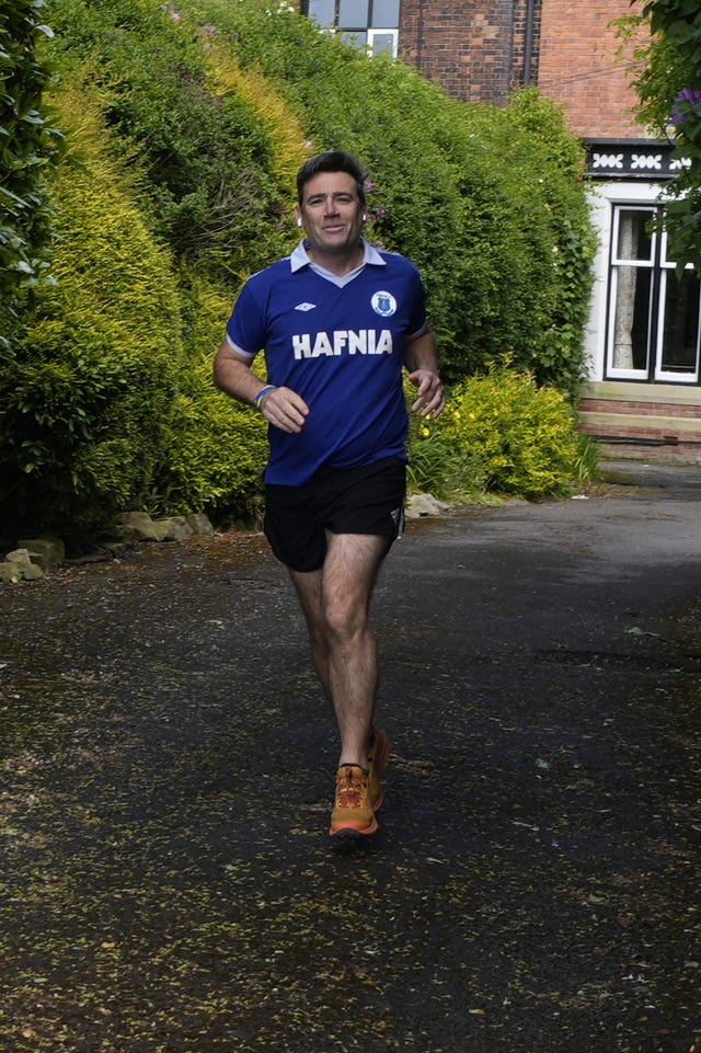 Mayor of Greater Manchester Andy Burnham outside his house in Warrington, Cheshire