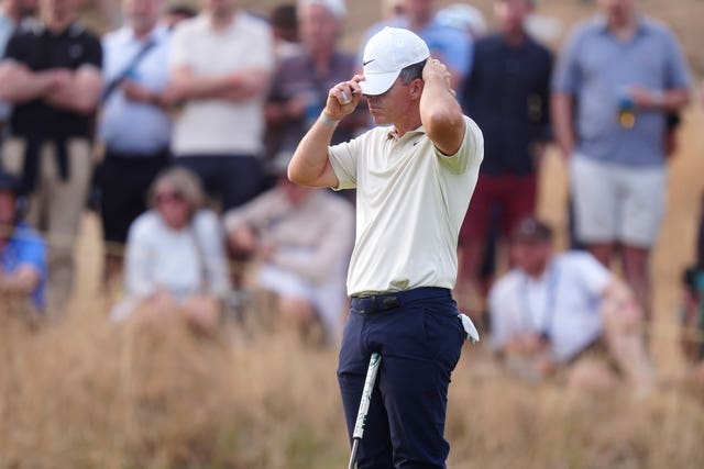 Rory McIlroy pulls his cap down over his eyes