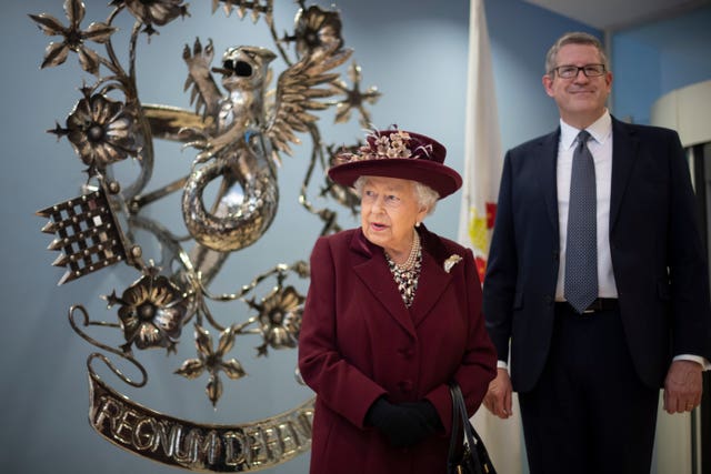 Baron Parker, pictured with the Queen during her MI5 visit, will begin his new role from April. Victoria Jones/PA Wire