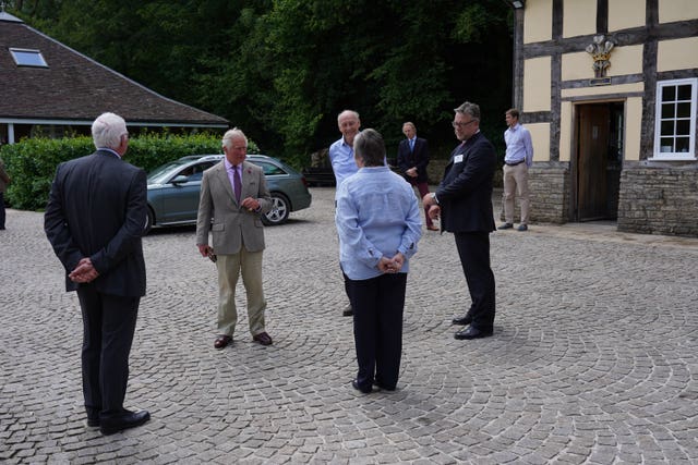 Charles observed social distancing during his mill visit. Arthur Edwards/The Sun