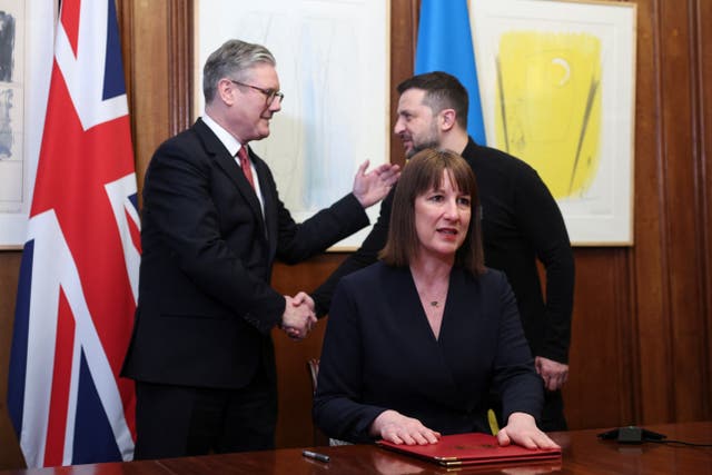 Rachel Reeves after signing the extraordinary revenue acceleration loans to Ukraine document as she holds a video conference meeting with Ukraine’s Finance Minister Sergii Marchenko, as Prime Minister Sir Keir Starmer and Ukrainian President Volodymyr Zelensky shake hands