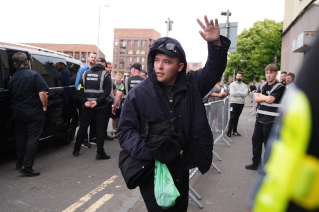 A member of Kneecap arrives at the O2 Academy in Glasgow before their concert
