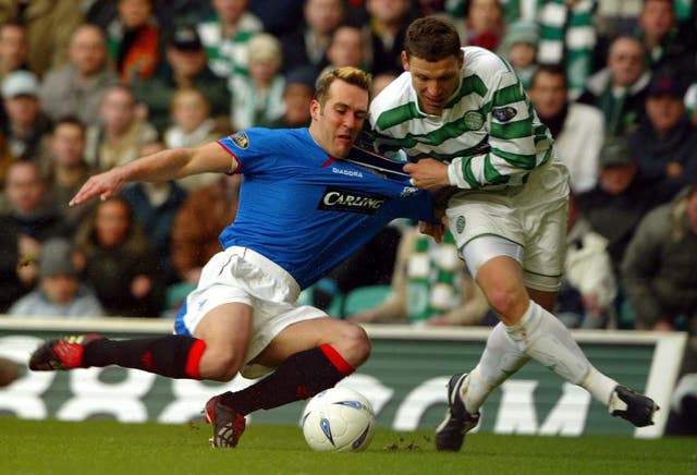 Fernando Ricksen battles for possession with Celtic's Alan Thompson during his playing days